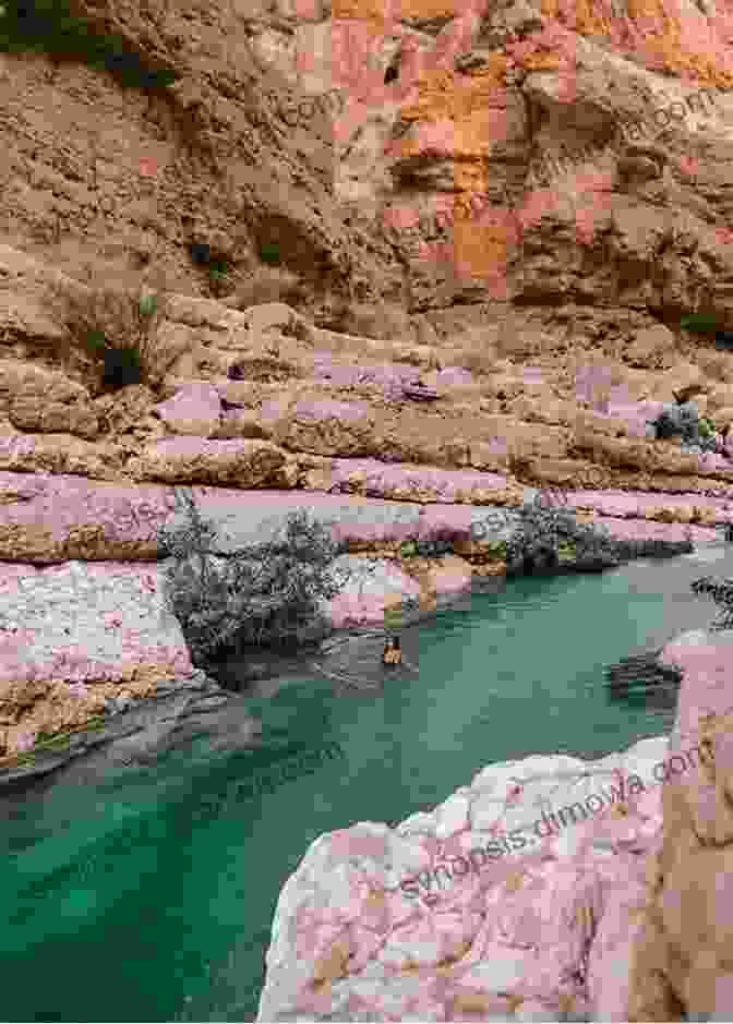 A Breathtaking View Of Wadi Shab, With Its Towering Cliffs, Crystal Clear Waters, And Lush Greenery. Oman Travel Guide And Travel Information