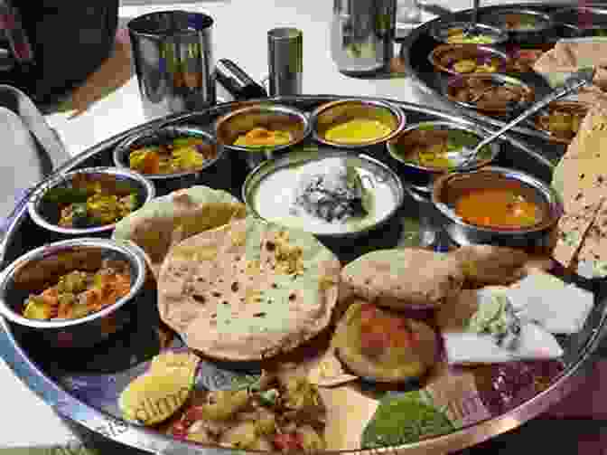 A Group Of Travelers Enjoying A Traditional Meal In An Indian Village Ultimate Of Adventure: Life Changing Excursions And Experiences Around The World