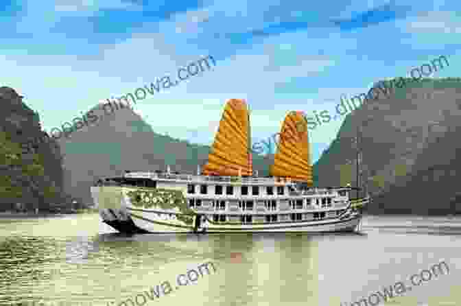 A Junk Boat Sails Through The Serene Waters Of Ha Long Bay Vietnam: Hanoi Ha Long Bay Ninh Binh