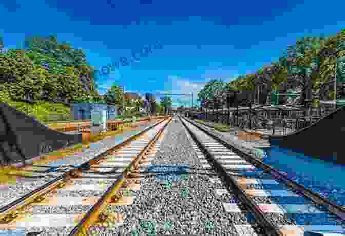 A Panoramic View Of Train Tracks Winding Through The Scenic European Countryside. Grand Tour: A Month On The Rails