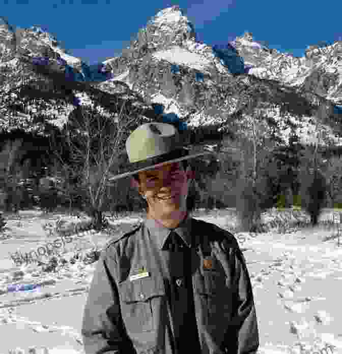 A Park Ranger Standing In Front Of A Majestic Mountain Range Hola Ranger My Journey Through The National Parks