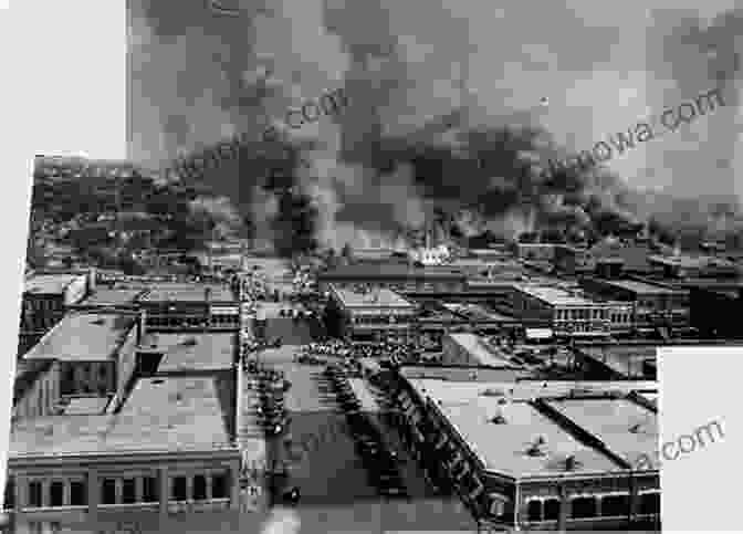 A Photograph Showing The Aftermath Of The Tulsa Race Massacre, With Burning Buildings And Destroyed Homes. Tales From The Greenwood District: A Peek Into Black Wall Street Before The Massacre