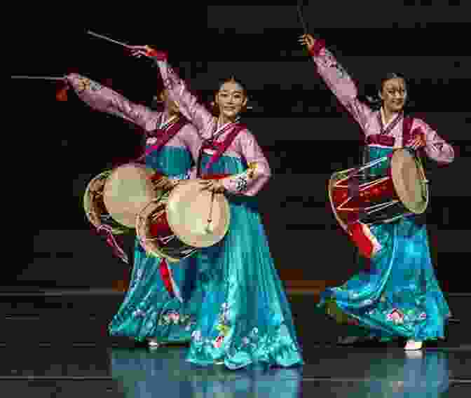 A Vibrant Image Of Korean Traditional Dancers Performing A Graceful And Colorful Dance. The Ultimate Guide To Visiting South Korea: Your Travel Guide To South Korea Travel Tips And More