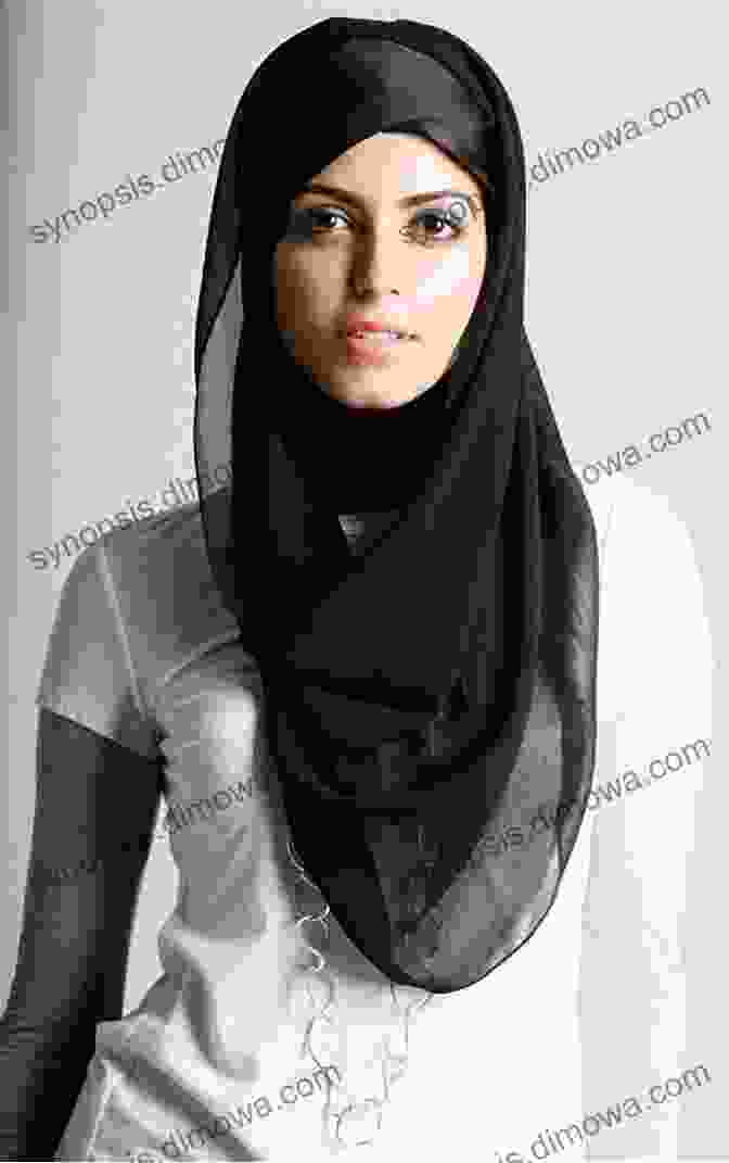 A Woman Wearing A Hijab With A Delicate Pin Attached. Latest Hijab Wraps: New Modern Hijab Styles For Women