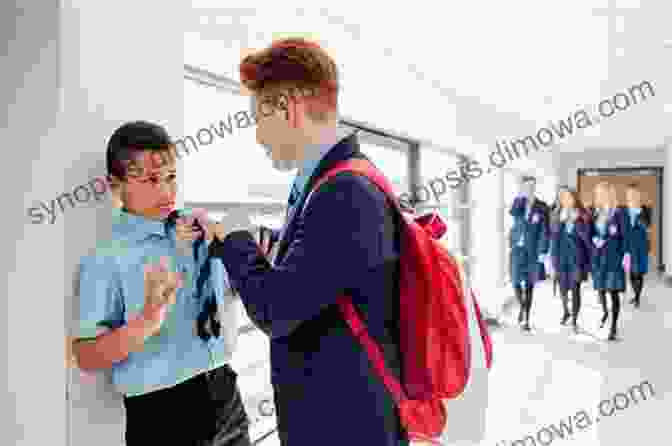 A Young Boy Standing Up To A Bully In The School Hallway. CHANDLER THE HANDLER CONFRONTS BULLYING IN MIDDLE SCHOOL