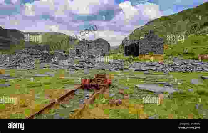 Abandoned Buildings And Rusty Mining Equipment Stand Amidst The Desolate Landscape Of Animas Forks, A Ghost Town Nestled High In The Mountains Mines Of The Alpine Loop