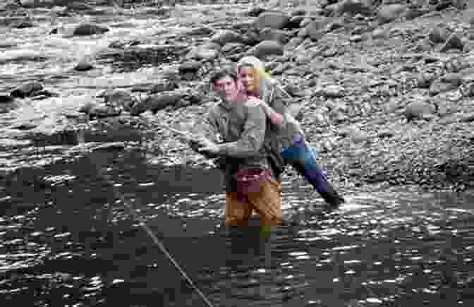 Gus Orviston And Allie Sharing A Tender Moment By The River, Symbolizing The Profound Connection They Forge And The Transformative Power Of Love And Companionship. The River Why David James Duncan