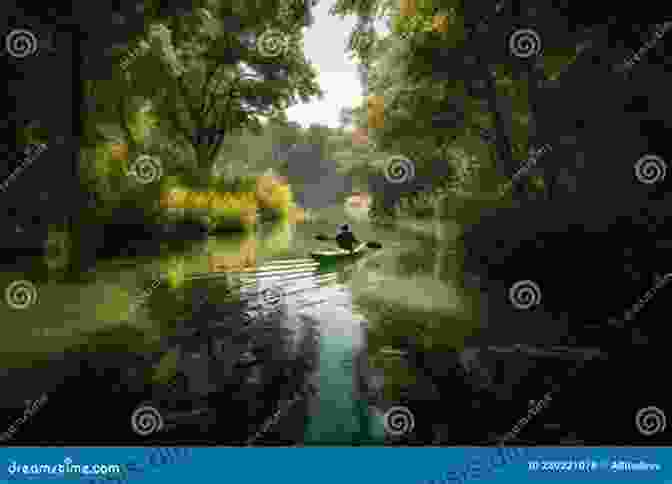 Kayaker Paddling Through Tranquil Waters Surrounded By Lush Greenery Kayaking The Thames From A Devon Pub To The Meridian Line