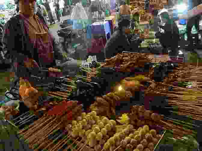 Street Food Vendors Grilling And Serving Vietnamese Delicacies Vietnam: Ho Chi Minh City